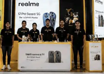 realme product booth staffed in a shopping centre