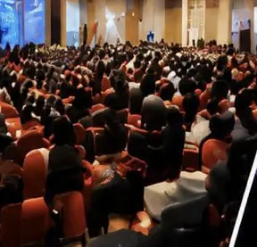 Packed auditorium at a corporate conference