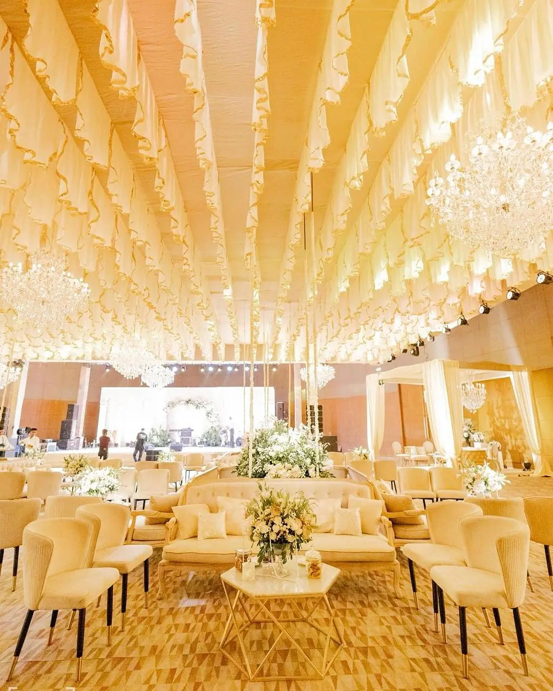 Banquet hall with draped ceiling and set tables