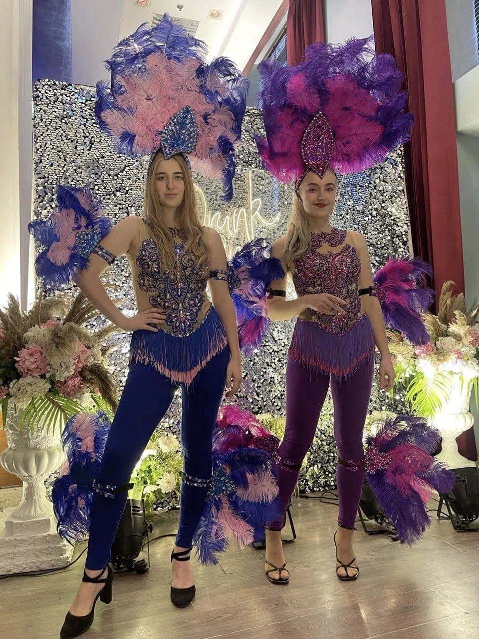 Costumed performers welcoming guests