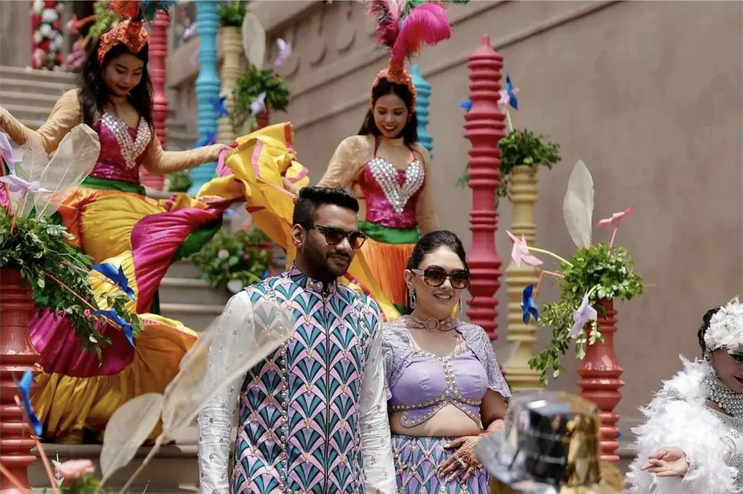 Costumed performers leading a wedding procession